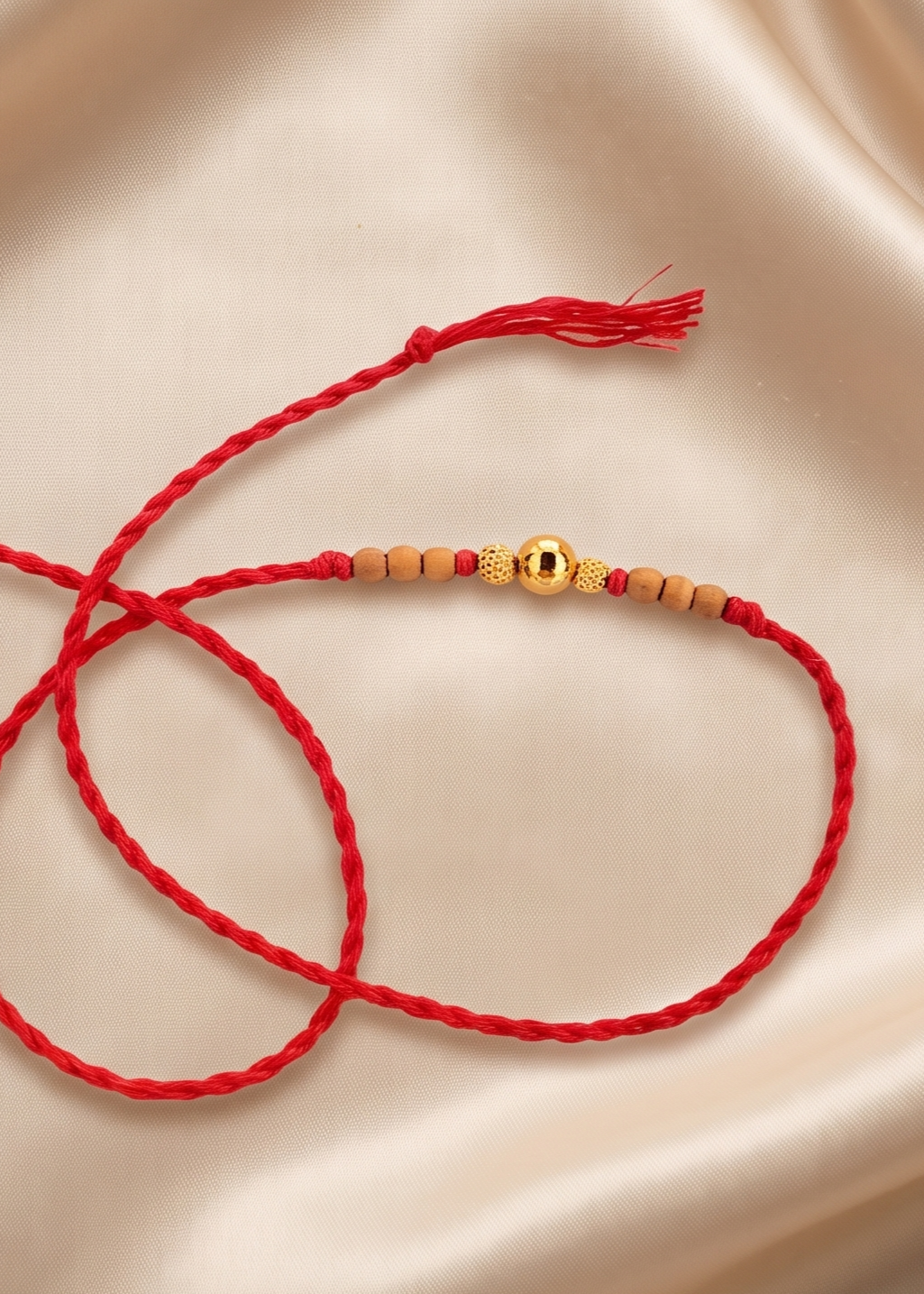 Authentic Tulsi Rakhi with Gold Central Bead